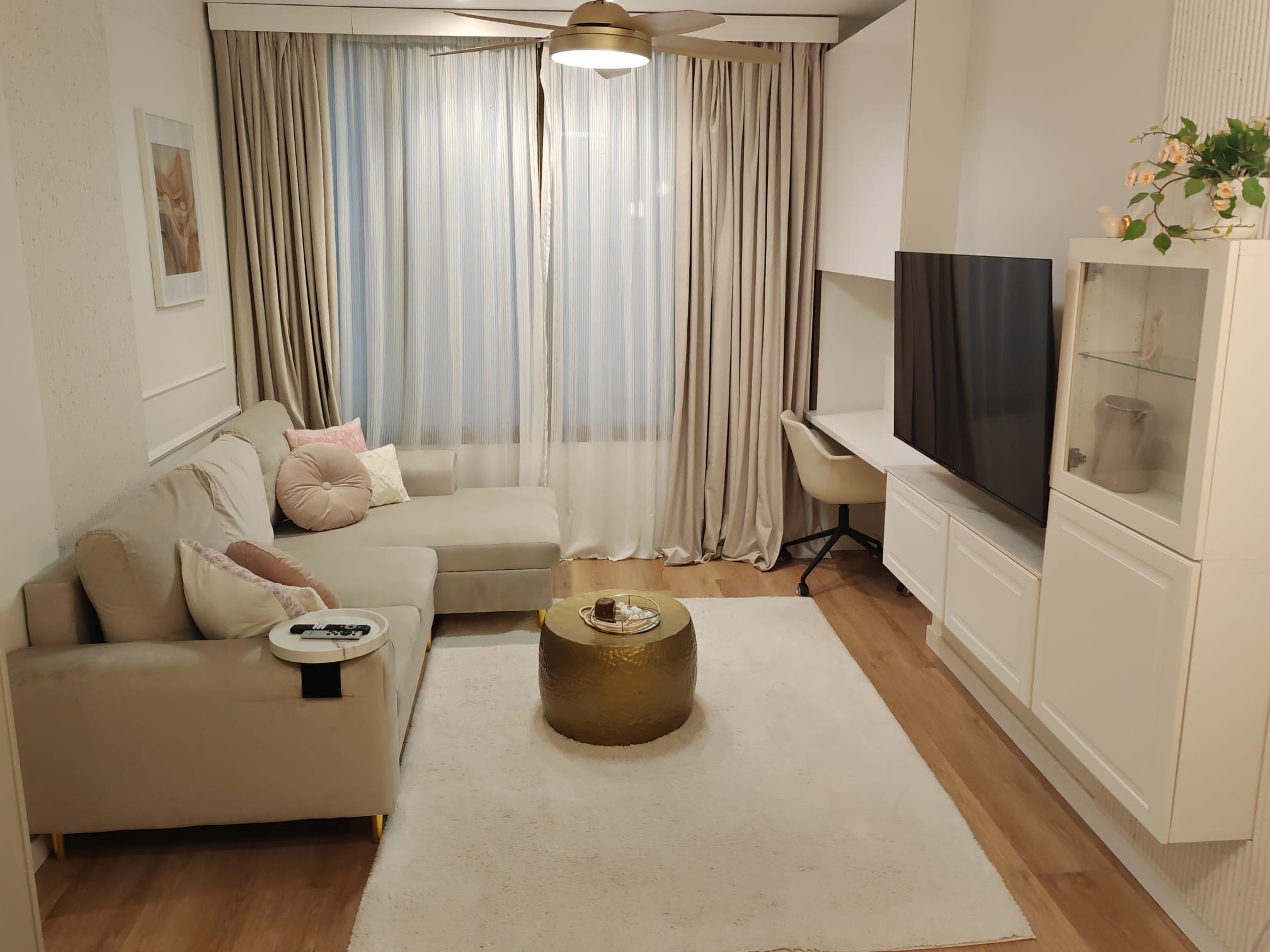 Comfortable double bedroom with soft pink design accents